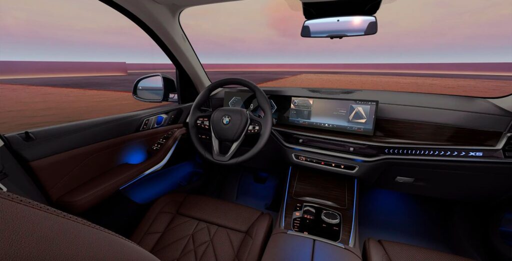 Interior delantero del BMW X5 xDrive30d con volante, salpicadero y asientos de cuero