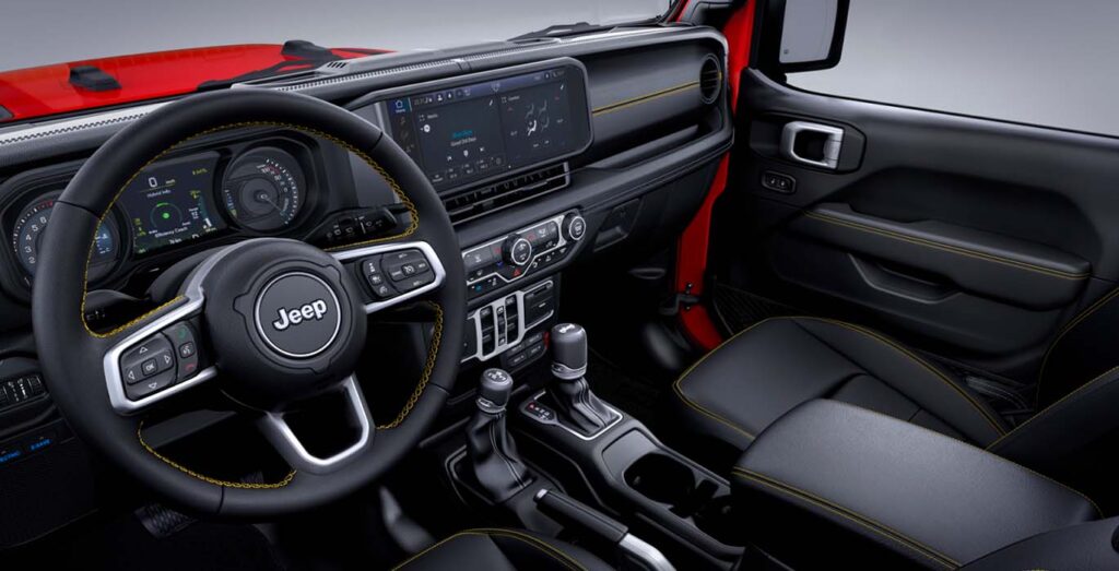 Interior delantero del Jeep Wrangler Sahara 2.0 TC GME disponible en renting